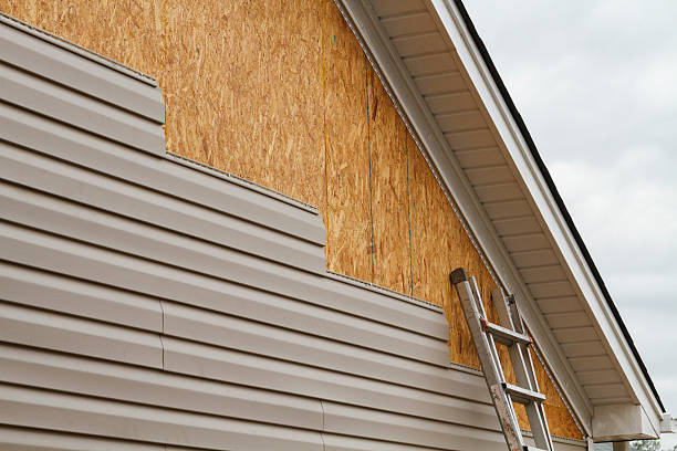 Professional Storm Damage Siding Repair technician working in Cambridge Springs, PA
